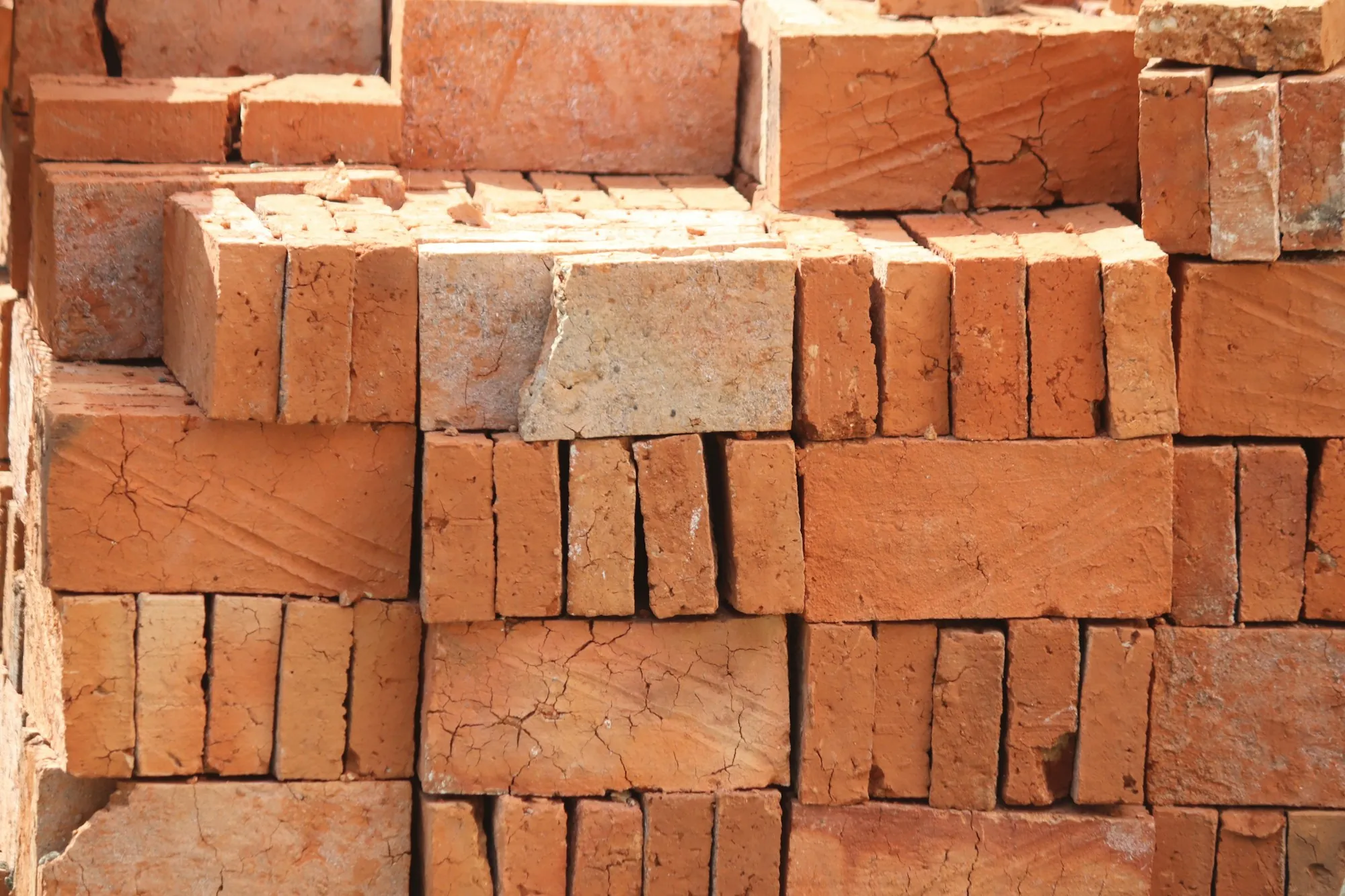 Stacked clay bricks ready for construction